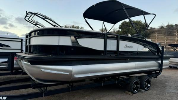 Barletta Lusso 23UC 2024 Barletta Lusso 23UC pontoon boat with sleek design and black canopy.