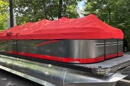 Qwest RLS 822 2023 Qwest RLS 822 pontoon boat with red cover, parked outdoors.
