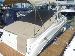 Maxum 2500 SCR 2001 Maxum 2500 SCR boat docked with beige cover and canopy.