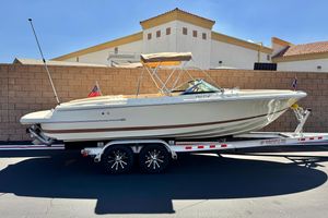 Chris-Craft Launch 22 2013 Chris-Craft Launch 22 boat on trailer, parked outdoors, sunny day.