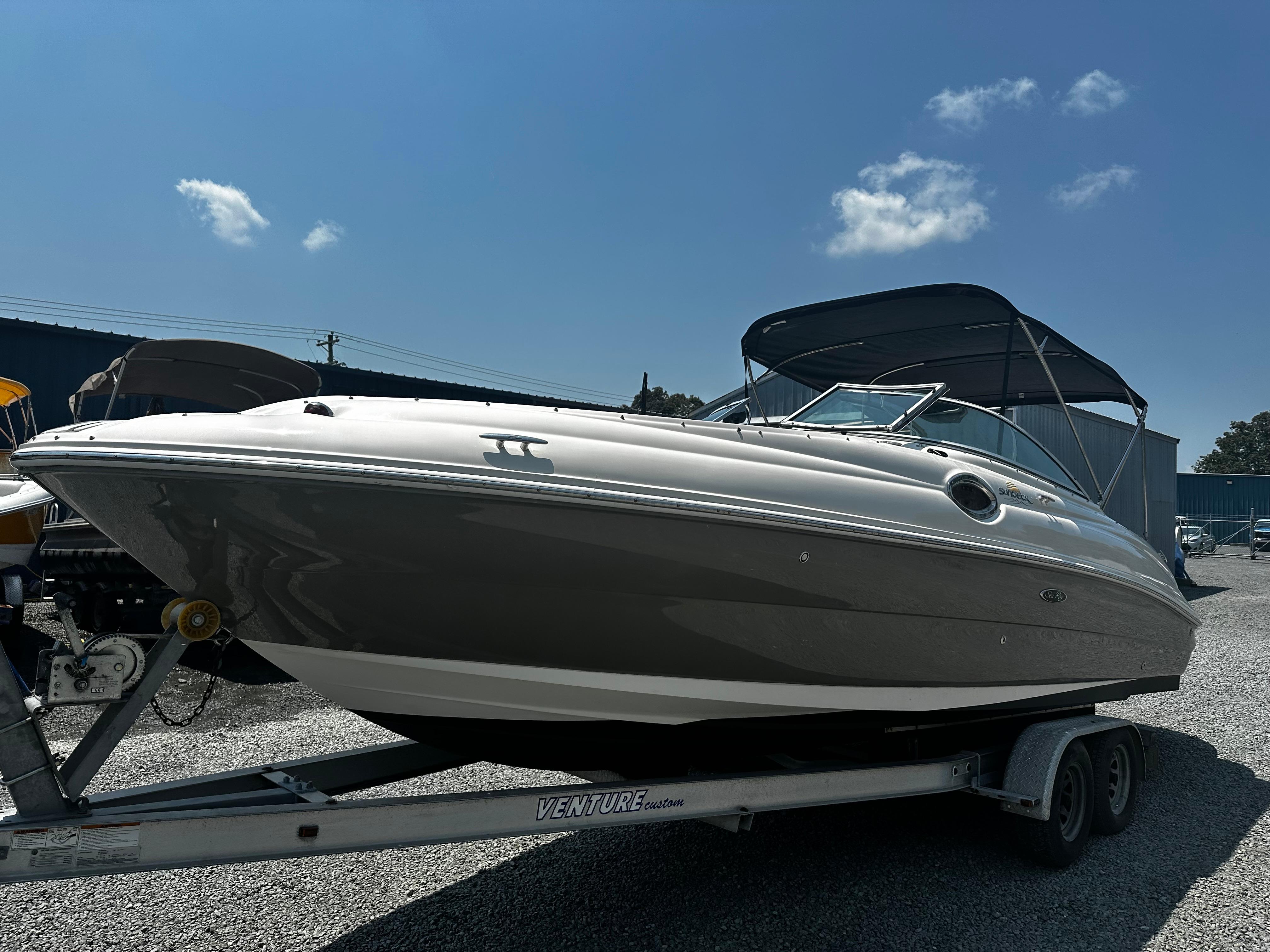 Sea Ray 240SD BOWRIDER 2006 Sea Ray 240SD Bowrider boat on trailer under clear blue sky.