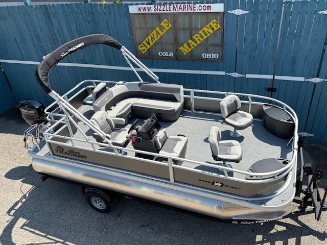 Sun Tracker Bass Buggy 18 DLX 2026 Sun Tracker Bass Buggy 18 DLX pontoon boat on trailer at Sizzle Marine dealership.