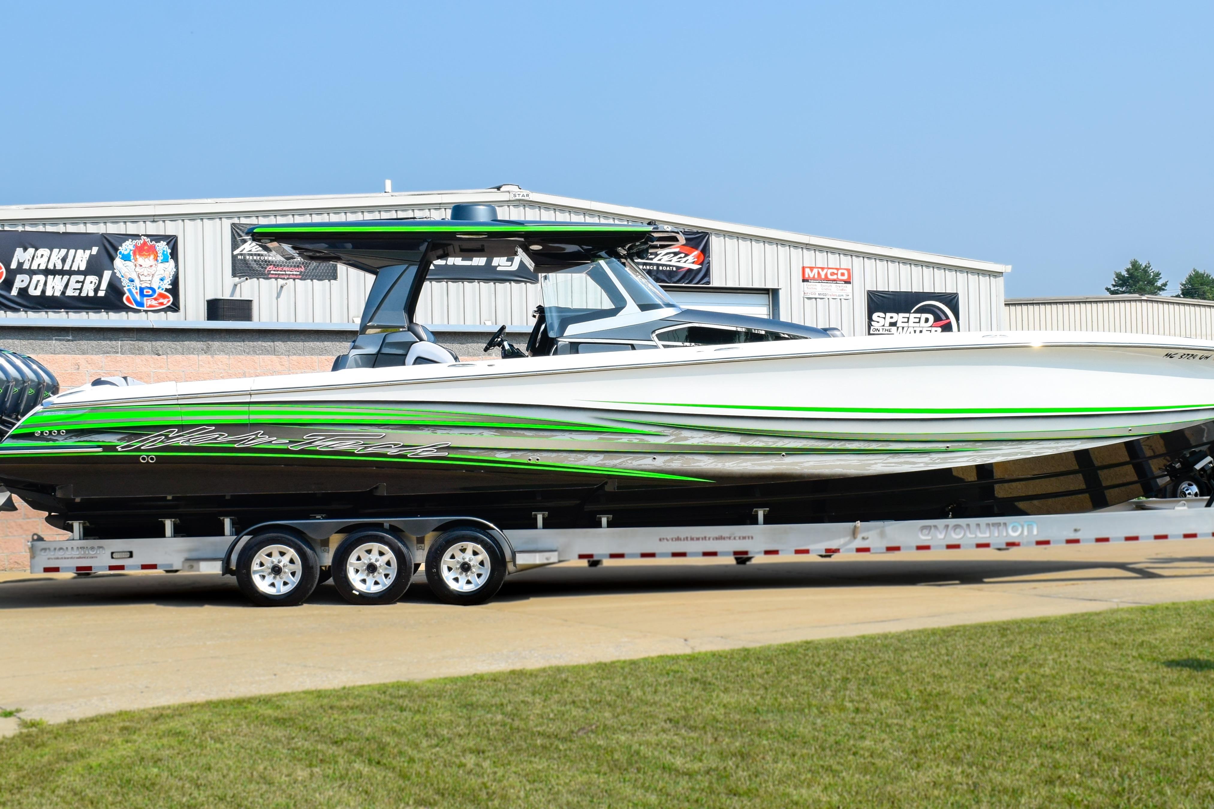 Nor-Tech 450 Sport Center Console 2019 Nor-Tech 450 Sport Center Console boat on trailer, featuring sleek green and white design.