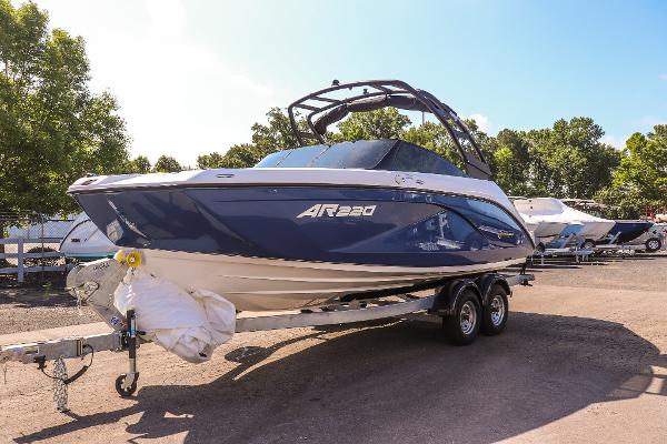 Yamaha Boats AR220 2025 Yamaha Boats AR220 on trailer, sleek design, parked outdoors.