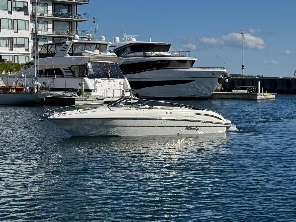 Windy Kharma A 2015 Windy Kharma boat cruising in a marina with yachts and buildings in the background.