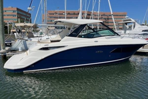 Sea Ray 320 Sundancer 2020 Sea Ray Sundancer 320 yacht docked in marina, blue and white exterior.