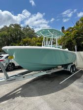 Aquasport 2200 CC 2026 Aquasport 2200 CC boat on trailer, parked outdoors under a sunny sky.