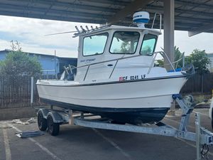 Arima Sea Chaser 19 Yellowtail Editi 2021 Arima Sea Chaser 19 Yellowtail Edition boat on trailer in parking lot.
