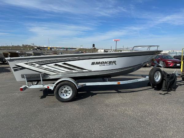 Smoker Craft Pro Lodge 160 2024 Smoker Craft Pro Lodge 160 boat on a trailer in a parking lot.