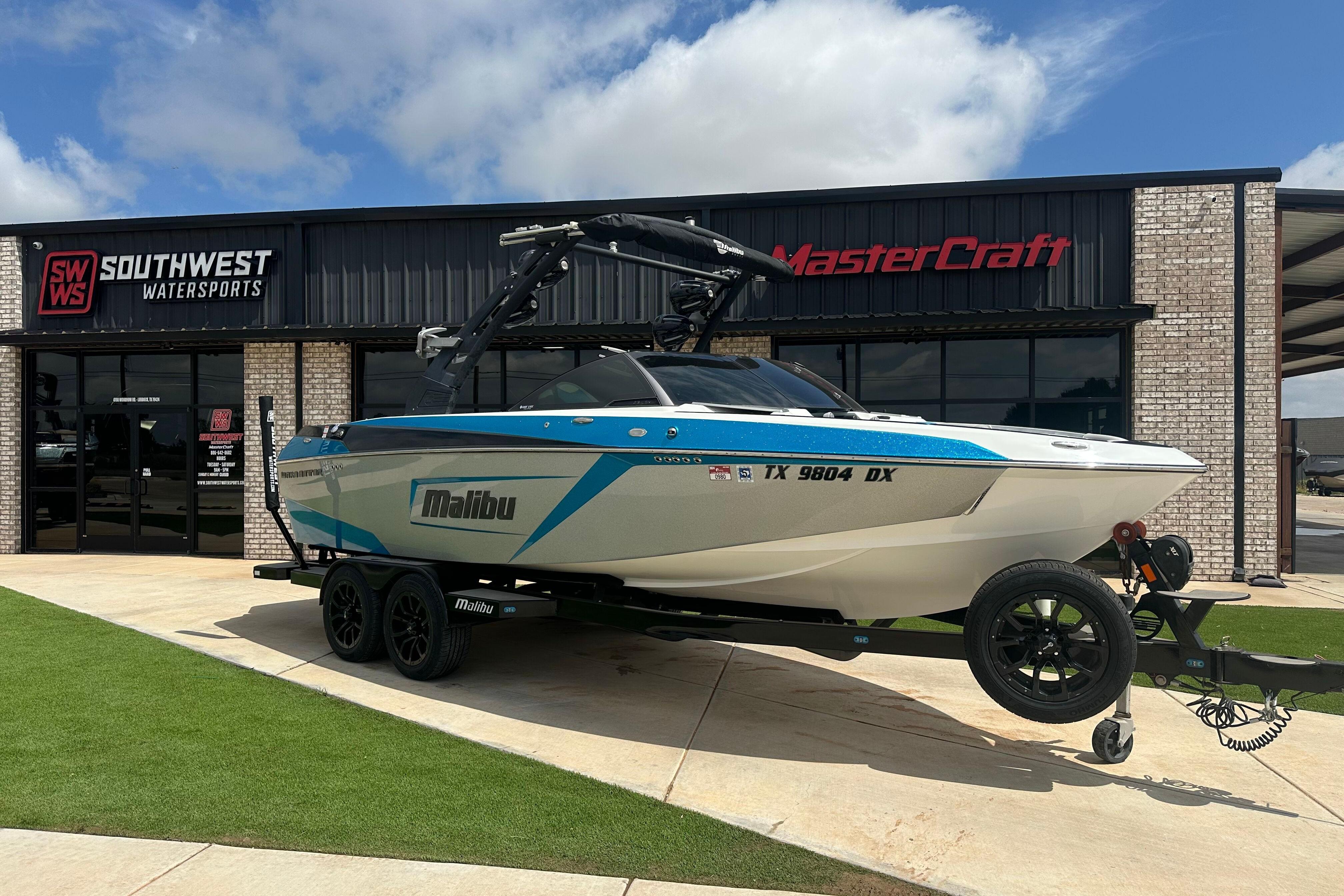 Malibu Wakesetter 23 LSV 2018 Malibu Wakesetter 23 LSV boat on trailer at Southwest Watersports dealership.
