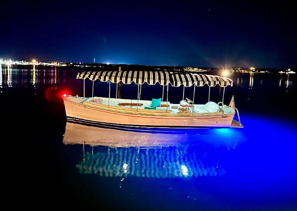 Duffy Bay Island 2013 Duffy Bay Island boat illuminated on calm night waters.