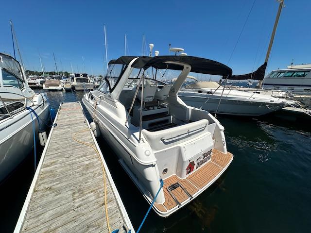 Wellcraft 2800 Martinique 1999 Wellcraft 2800 Martinique docked at a marina on a sunny day.