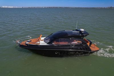 Hanover 355 Outboard 2025 Hanover 355 Outboard boat cruising on open water, sleek black design.