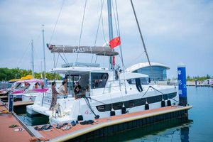 Bali 4.2 2021 Bali 4.2 catamaran docked at marina with people onboard.
