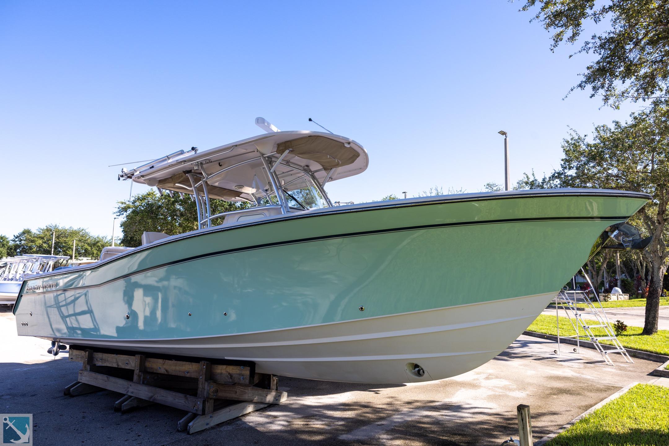 Grady-White Canyon 336 2012 Grady-White Canyon 336 boat on display, light blue hull, outdoor setting.