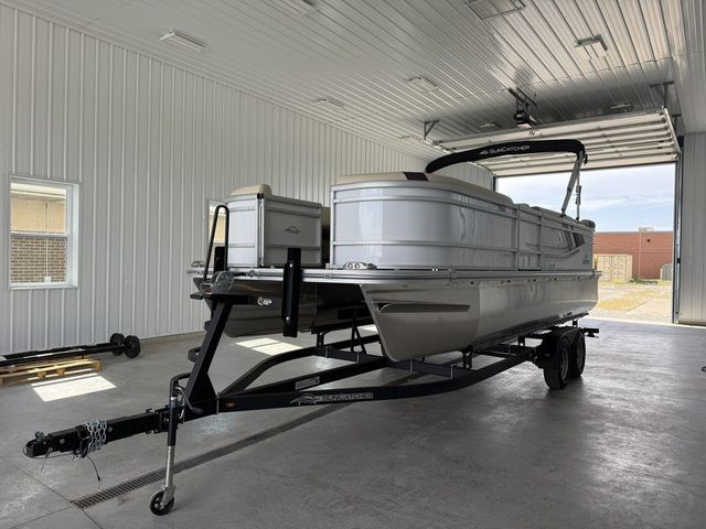 G3 SELECT 22C 2026 G3 SELECT 22C pontoon boat on trailer in a garage.