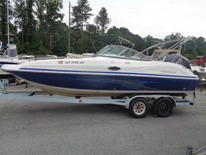 Hurricane SunDeck 217 OB 2011 Hurricane SunDeck 217 OB boat on a trailer in a parking lot.