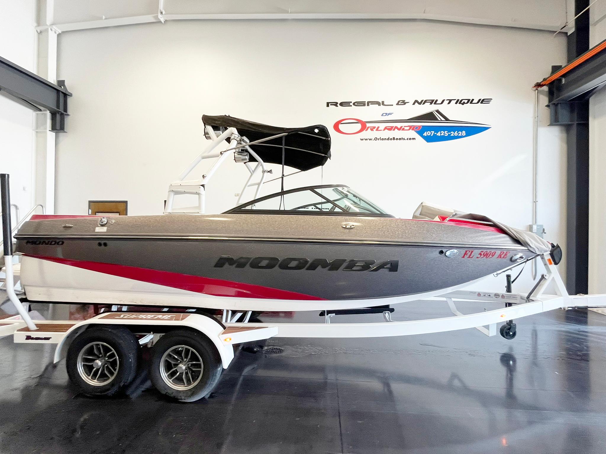 Moomba Mondo 2016 Moomba Mondo boat on trailer in showroom, side view.