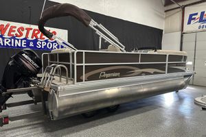 Premier SunSpree 220 2016 Premier SunSpree 220 pontoon boat with Mercury outboard motor in showroom.