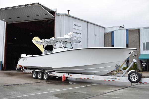 Yellowfin 39 Offshore 2023 Yellowfin 39 Offshore boat on a trailer outside a warehouse.