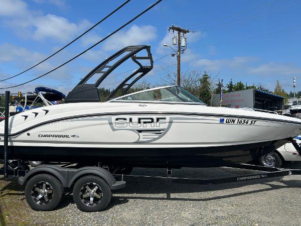 Chaparral 23 H2O Surf 2019 Chaparral 23 H2O Surf boat on trailer, side view, outdoors.