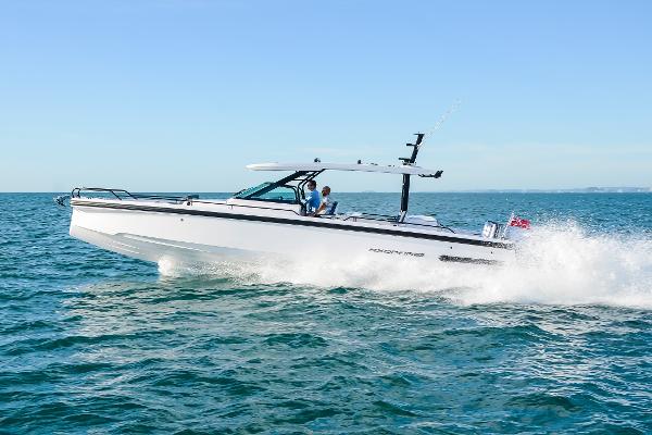 Axopar 37 Sun Top 2024 Axopar 37 Sun Top cruising on open water, showcasing sleek design and performance.