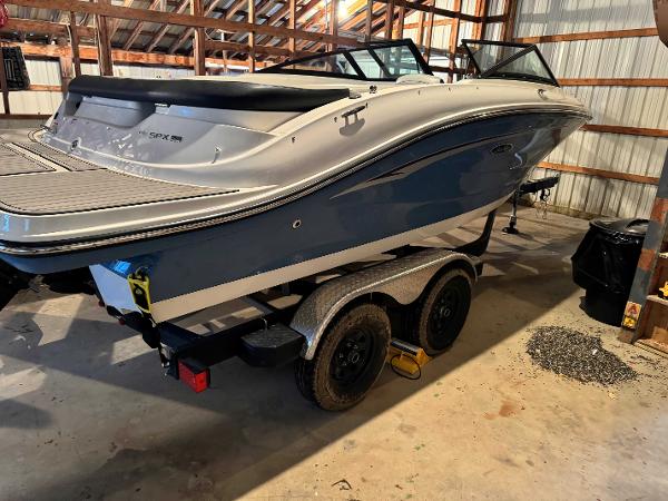 Sea Ray SPX 190 2022 Sea Ray SPX 190 boat on trailer in a garage.