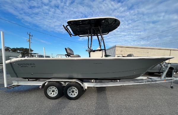 Carolina Skiff 24 Ultra Elite 2025 Carolina Skiff 24 Ultra Elite boat on trailer, side view, outdoors.