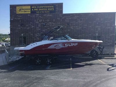 Chaparral 23 Surf 2025 Chaparral 23 Surf boat in red, parked outside Premier Motor Sports.
