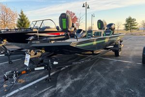 Ranger RT198P 2026 Ranger RT198P fishing boat on trailer, featuring Minn Kota motor, parked outdoors.