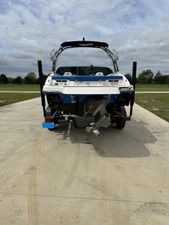 Chaparral 21 H2O Surf 2019 Chaparral 21 H2O Surf boat on a concrete driveway, rear view.