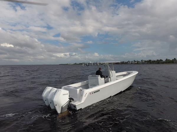 Contender 35 ST 2021 Contender 35 ST boat cruising on open water under cloudy skies.