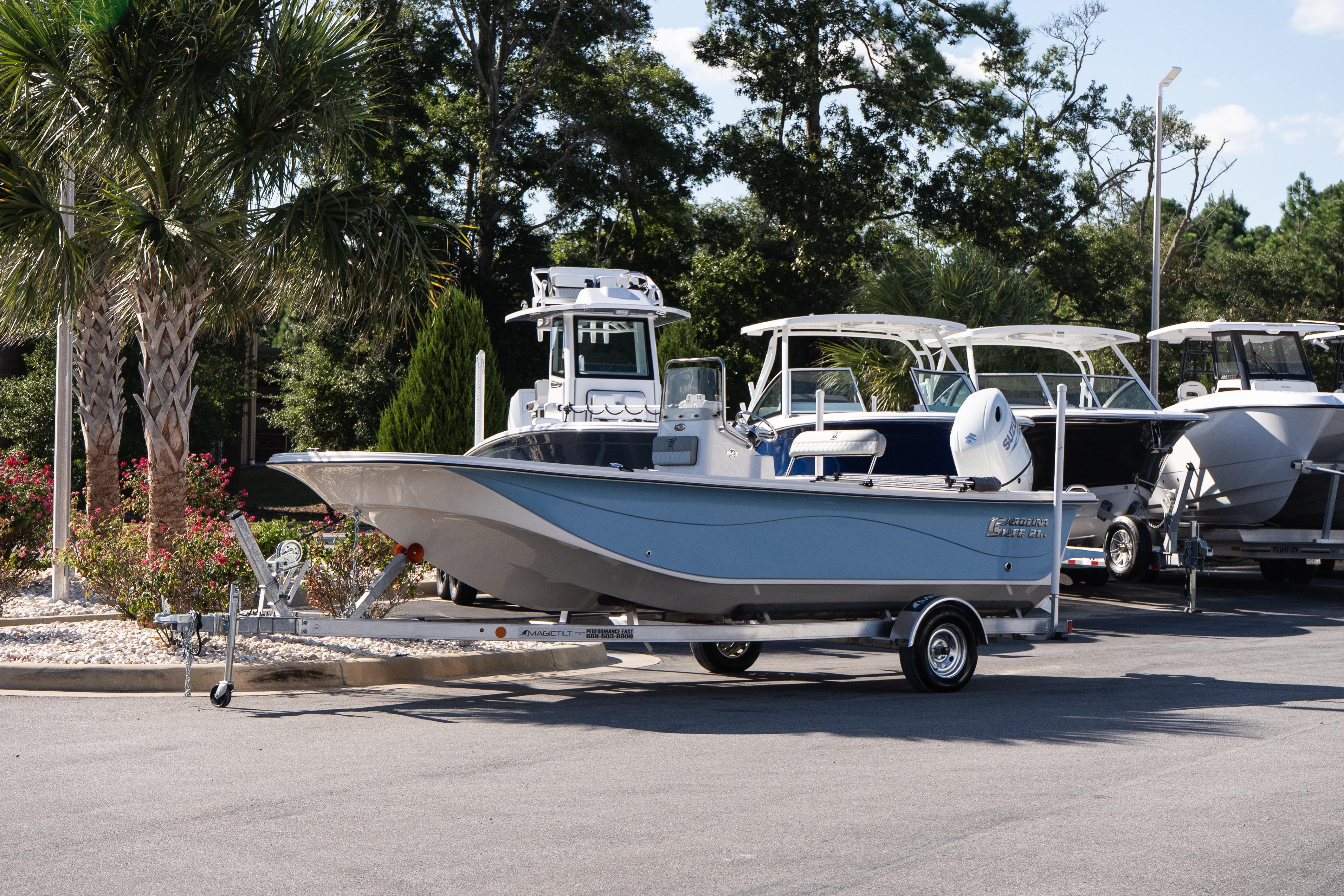 Carolina Skiff 21 LS 2026 Carolina Skiff 21 LS boat on trailer in a sunny outdoor setting.