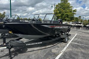 Tracker Pro Guide V-175 Combo 2026 Tracker Pro Guide V-175 Combo boat on trailer in parking lot.