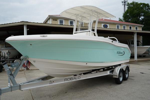 Robalo R202 Explorer 2025 Robalo R202 Explorer boat on trailer, light blue hull, parked outdoors.