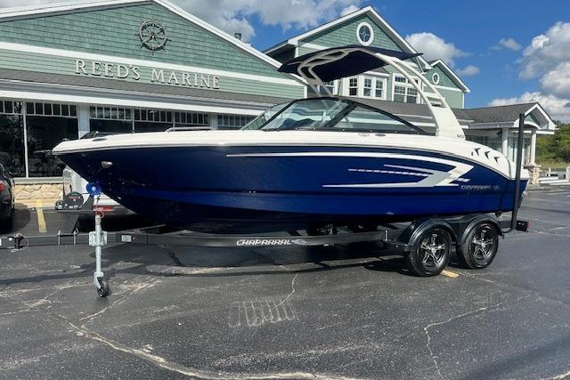 Chaparral 21 SSi 2026 Chaparral 21 SSi boat on trailer outside Reed's Marine dealership.