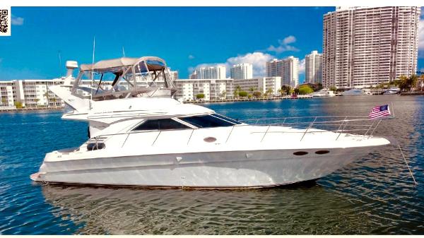Sea Ray 400 Sedan Bridge 1998 Sea Ray 400 Sedan Bridge yacht on water with city skyline background.