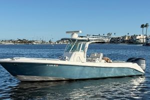 Everglades 290 Center Console 2008 Everglades 290 Center Console boat on calm water, coastal background.