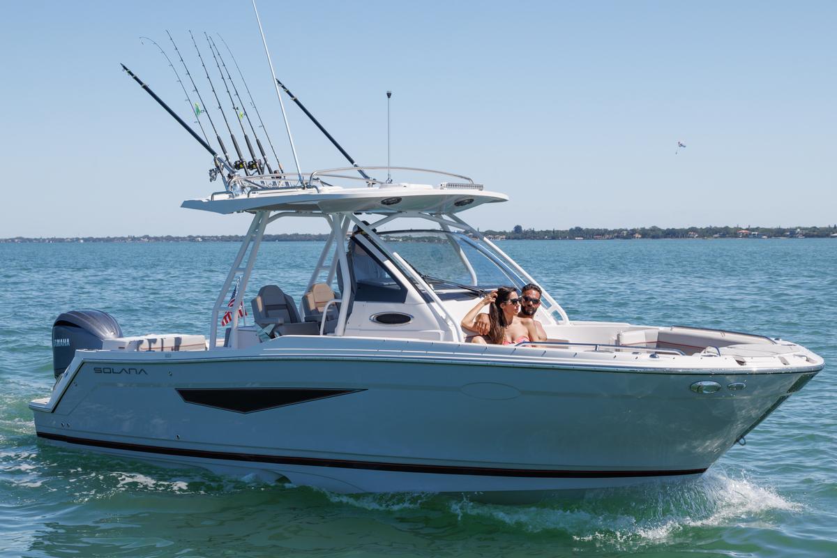 Solara S-250 CW 2026 Solara S-250 CW boat cruising on open water with passengers enjoying the ride.