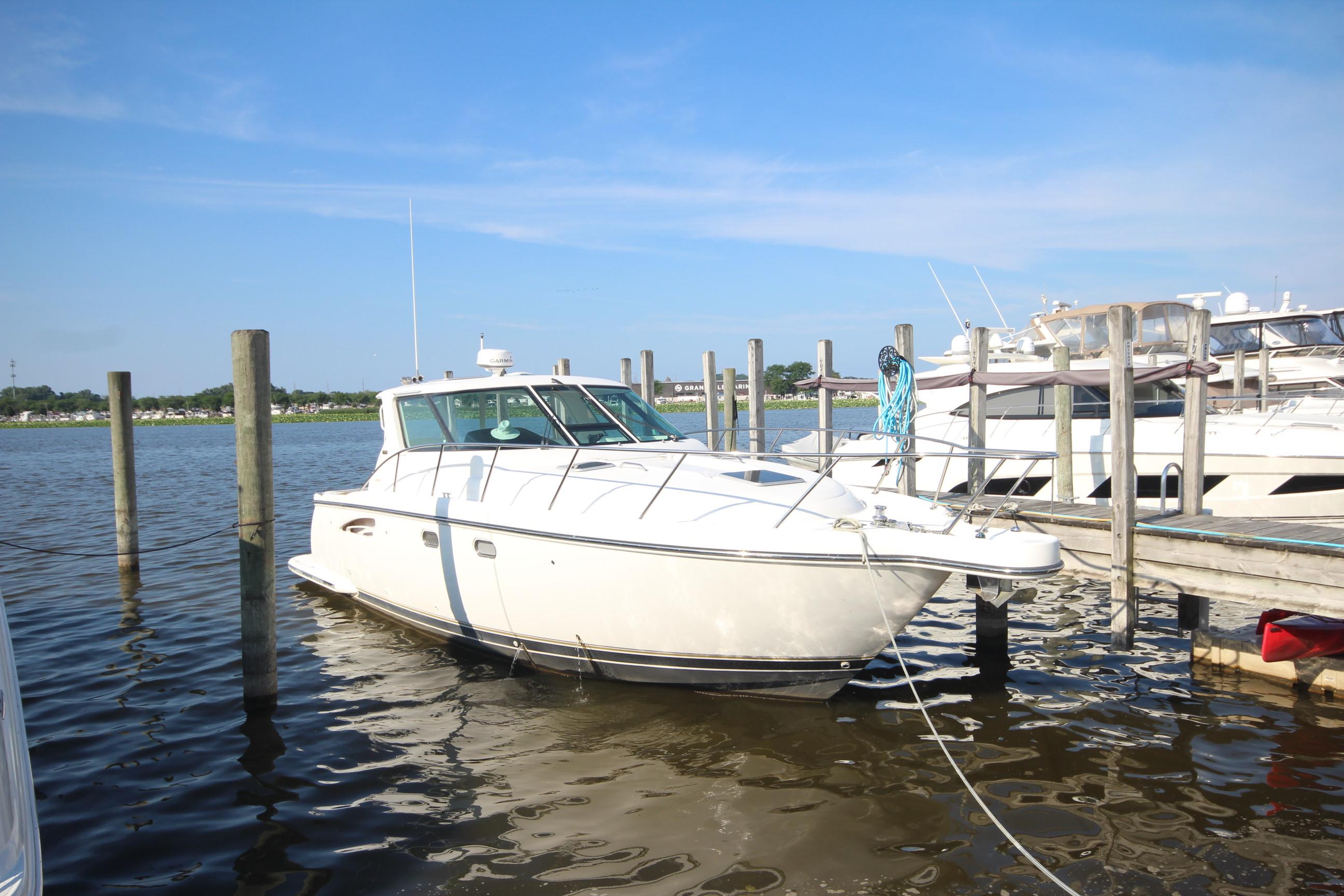 Tiara Yachts 3600 Sovran 2004 Tiara Yachts 3600 Sovran docked at a marina under clear blue skies.