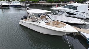 Scout 255 Dorado 2019 Scout 255 Dorado boat docked in a marina, surrounded by other vessels.
