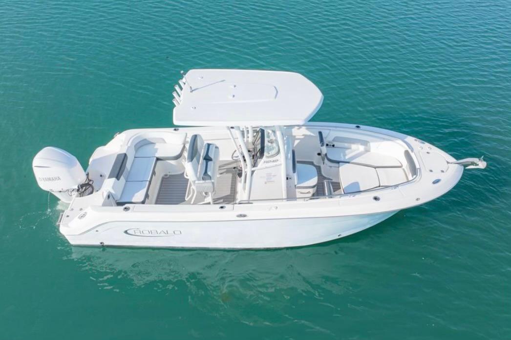 Robalo R242 Explorer 2019 Robalo R242 Explorer boat on clear blue water, aerial view.