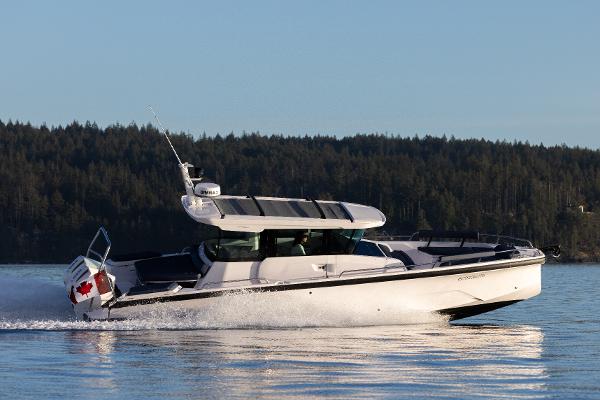Axopar 29 XC Cross Cabin BRABUS Line 2025 Axopar 29 XC Cross Cabin BRABUS Line cruising on a serene lake.