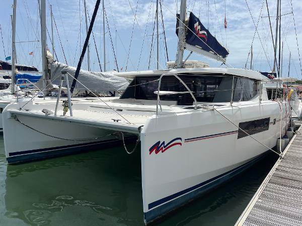 Leopard 45 2019 Leopard 45 catamaran docked at marina, front view.