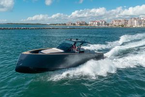 Pardo Yachts 43 2023 Pardo Yachts 43 cruising on blue waters near coastal buildings.