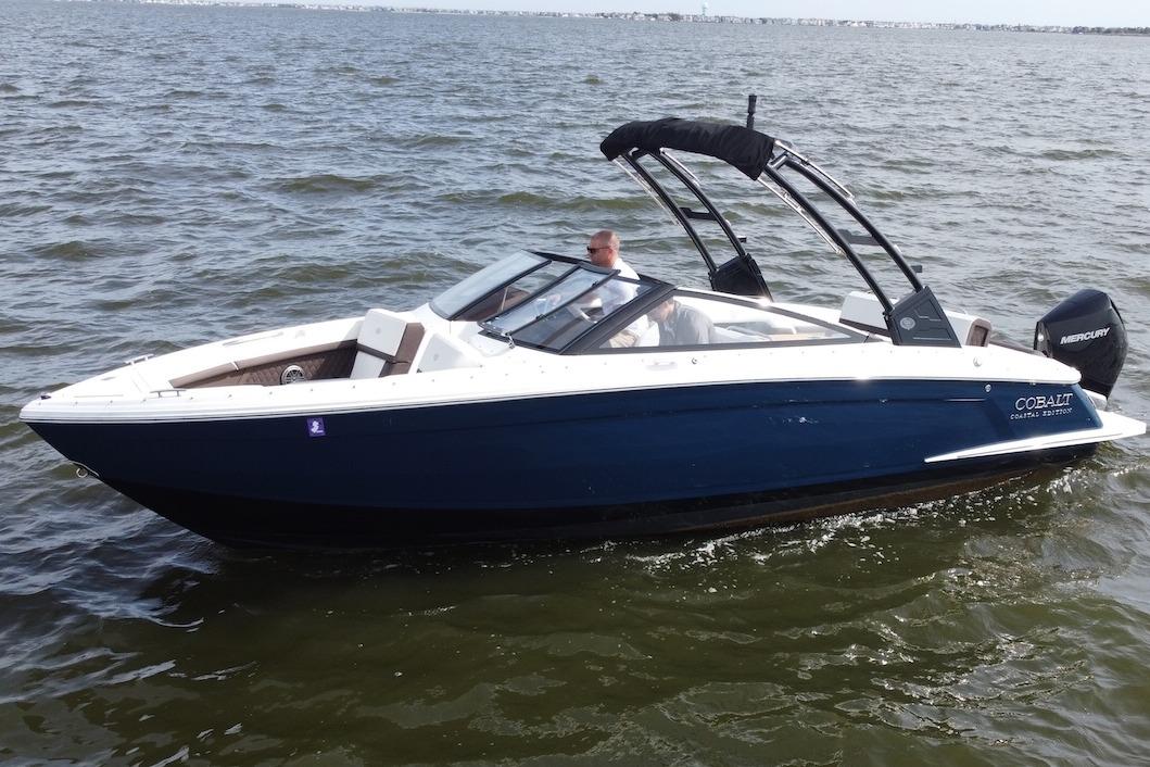 Cobalt R4 Outboard 2024 Cobalt R4 Outboard boat cruising on open water.