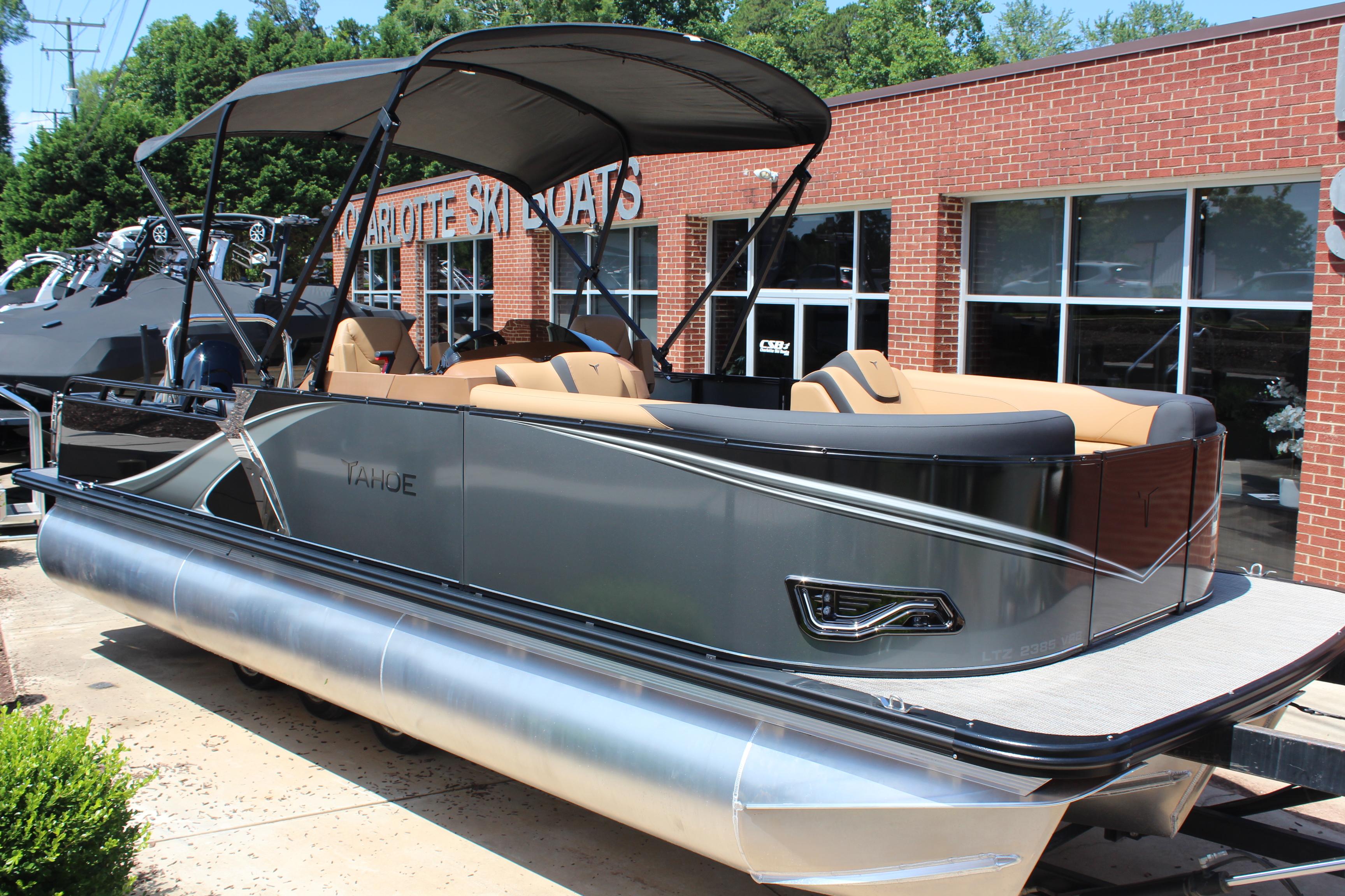 Tahoe Pontoon LTZ Versatile Rear Lounger 2025 Tahoe Pontoon LTZ Versatile Rear Lounger at dealership, sleek design, outdoor display.
