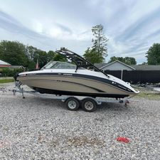 Yamaha Boats 242 Limited S 2013 Yamaha Boats 242 Limited S on trailer, parked outdoors on gravel.