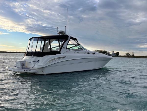 Sea Ray 360 Sundancer 2002 Sea Ray 360 Sundancer yacht on calm waters under a cloudy sky.