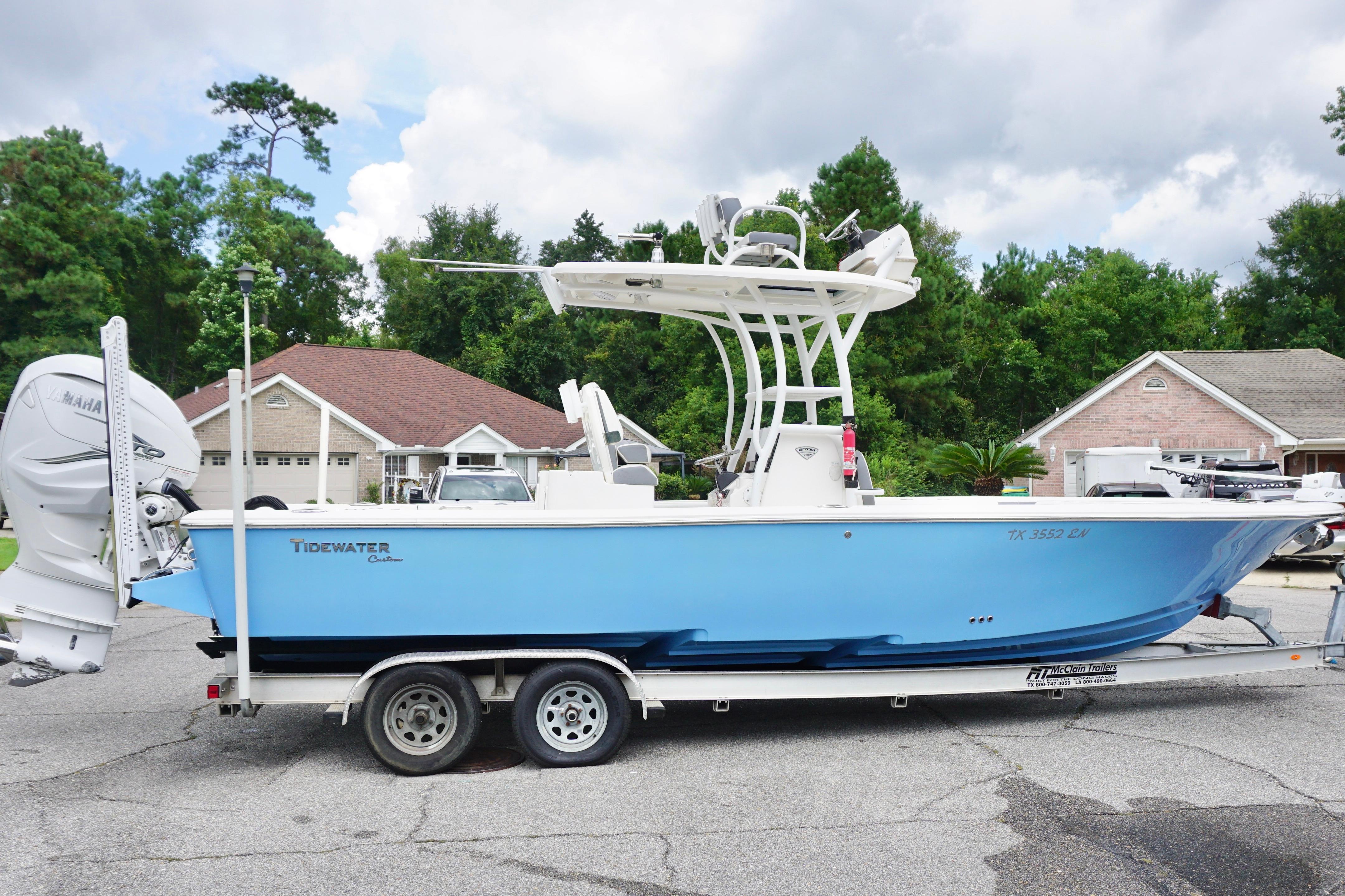 Tidewater 2700 Carolina Bay 2019 Tidewater 2700 Carolina Bay boat on trailer, parked in residential area.